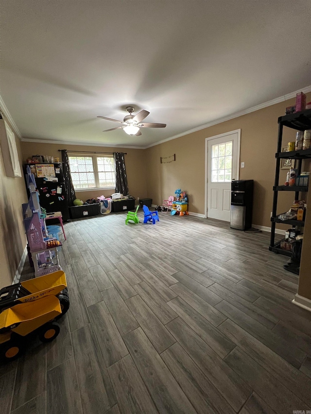 interior space with crown molding, dark hardwood / wood-style flooring, and ceiling fan