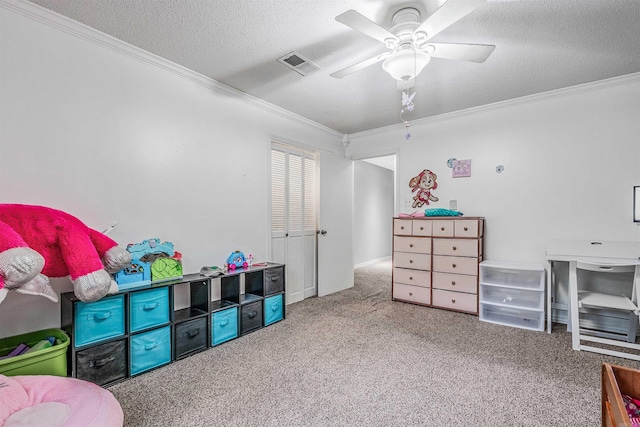 game room with crown molding, ceiling fan, and carpet