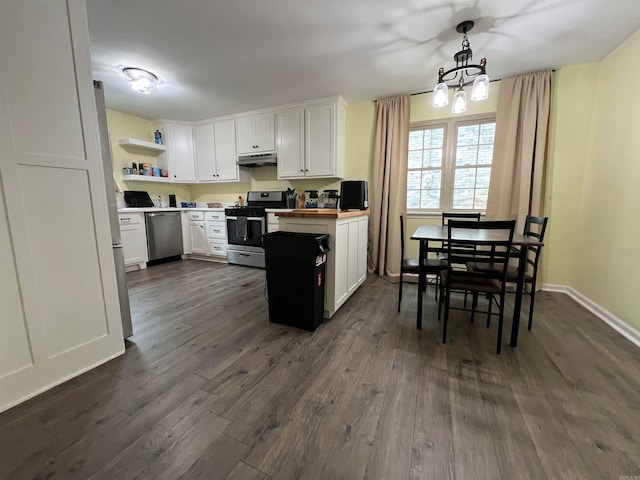 kitchen with dark hardwood / wood-style floors, a notable chandelier, appliances with stainless steel finishes, hanging light fixtures, and white cabinetry