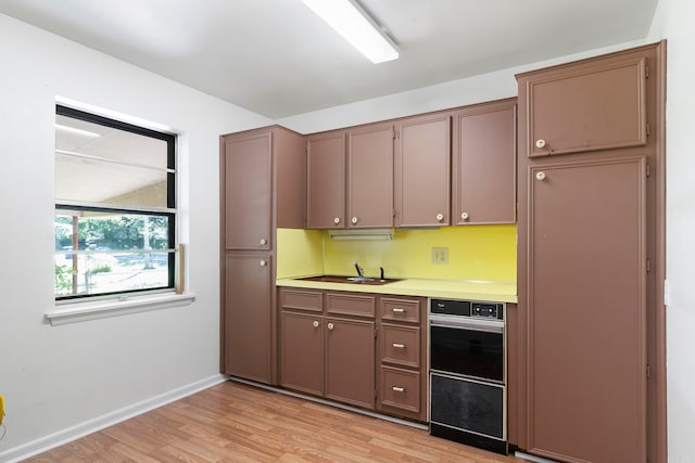 kitchen featuring light hardwood / wood-style floors and sink