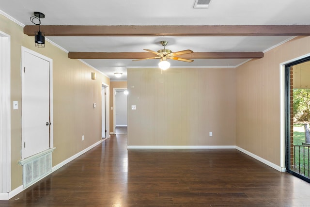 empty room with ceiling fan, dark hardwood / wood-style floors, beamed ceiling, and ornamental molding