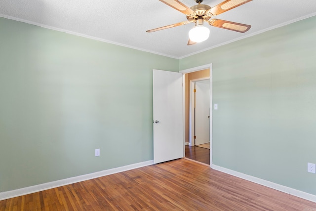 unfurnished room featuring a textured ceiling, crown molding, ceiling fan, and hardwood / wood-style floors