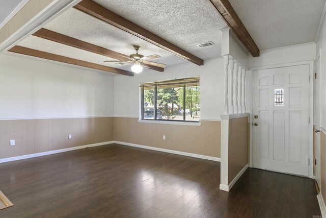 entryway featuring beamed ceiling, a textured ceiling, ceiling fan, and dark hardwood / wood-style floors