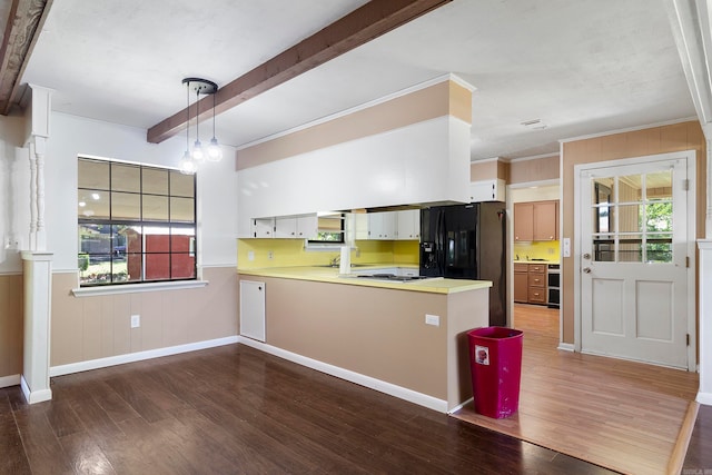 kitchen with white cabinets, hanging light fixtures, black fridge with ice dispenser, kitchen peninsula, and dark wood-type flooring