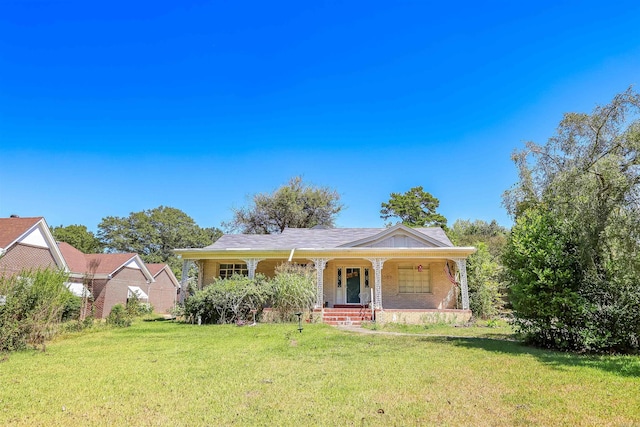 view of front of property with a porch and a front lawn