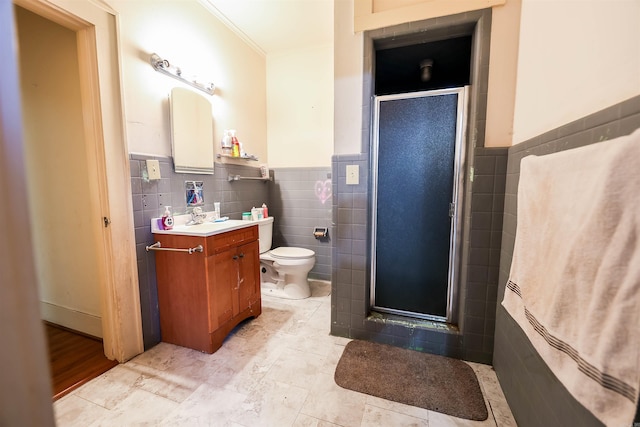 bathroom featuring an enclosed shower, crown molding, toilet, tile walls, and vanity