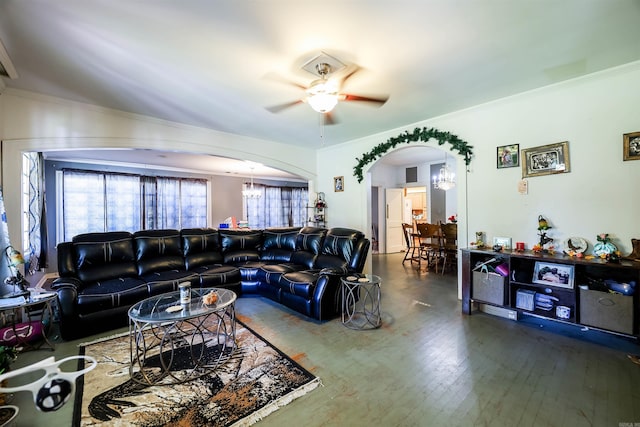 living room with ceiling fan with notable chandelier, crown molding, and wood-type flooring