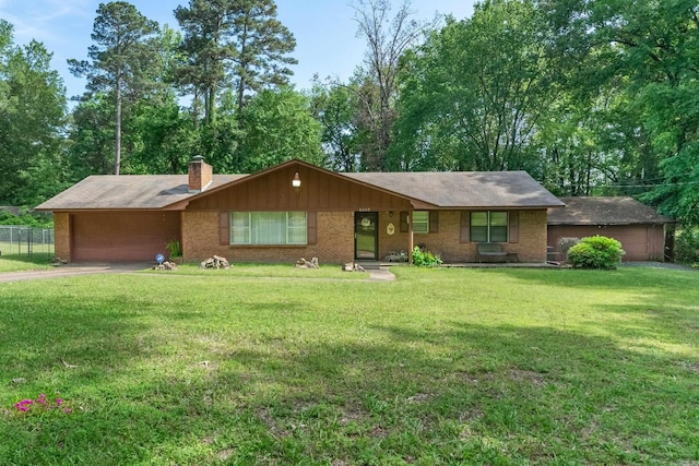 ranch-style home with concrete driveway, an attached garage, a front yard, brick siding, and a chimney