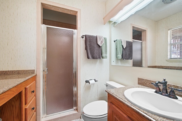 full bath with a shower stall, toilet, and vanity