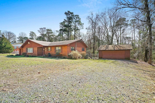 exterior space with an outbuilding, a storage unit, and a lawn