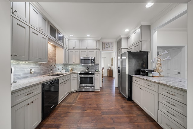 kitchen featuring backsplash, appliances with stainless steel finishes, crown molding, dark wood-type flooring, and sink