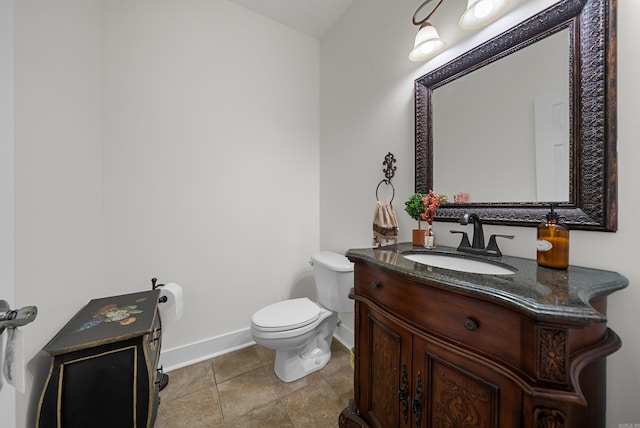 bathroom featuring vanity, toilet, and tile patterned floors