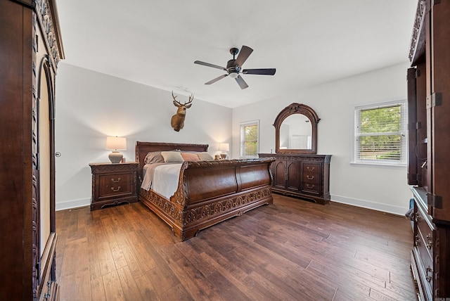 bedroom featuring ceiling fan and dark hardwood / wood-style floors