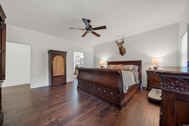 bedroom with ceiling fan, dark hardwood / wood-style floors, and ensuite bath