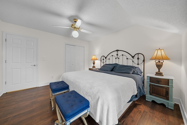 bedroom featuring a closet, ceiling fan, dark hardwood / wood-style floors, and vaulted ceiling