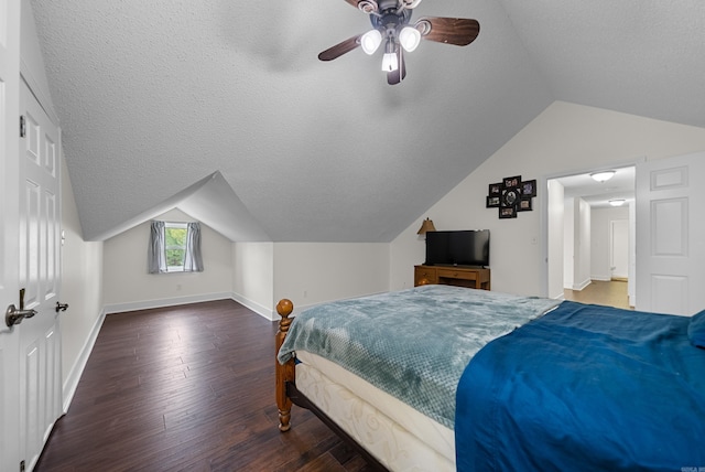 bedroom with lofted ceiling, ceiling fan, and dark hardwood / wood-style flooring