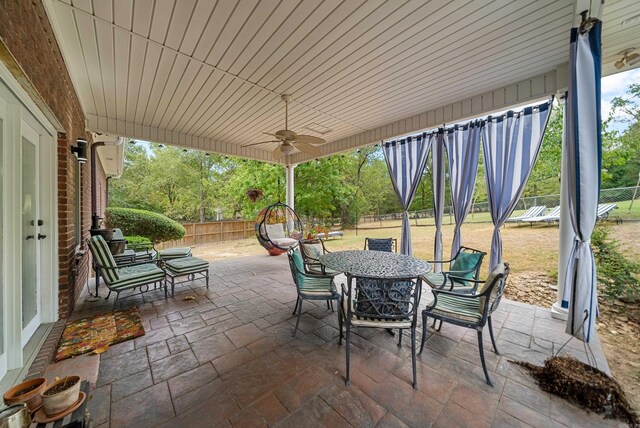 view of patio featuring ceiling fan