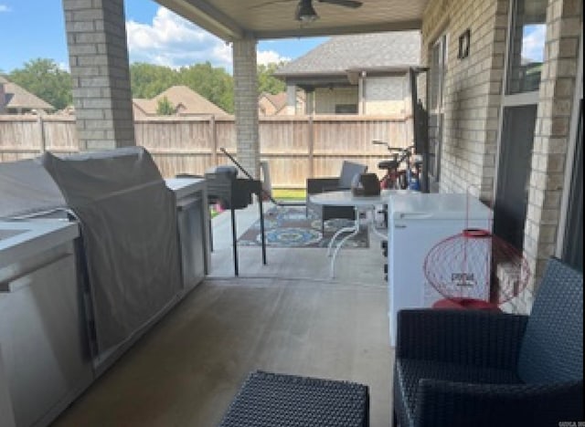 view of patio featuring ceiling fan