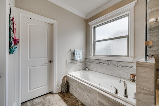 bathroom with ornamental molding, tiled tub, and plenty of natural light