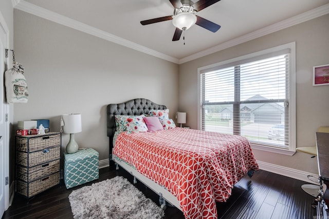 bedroom with crown molding, dark hardwood / wood-style floors, and ceiling fan