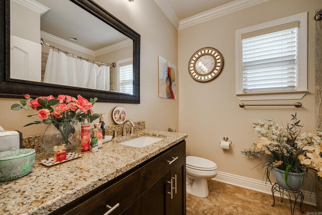 bathroom featuring vanity, plenty of natural light, toilet, and crown molding