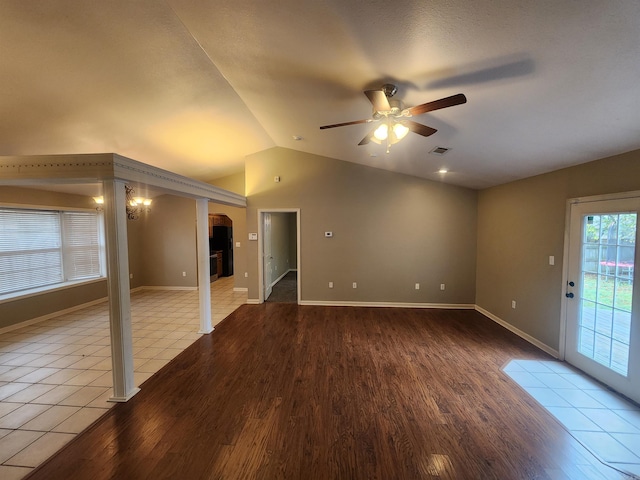 unfurnished room featuring ceiling fan, light wood-type flooring, and vaulted ceiling