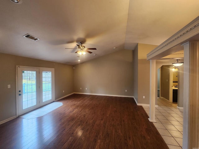 unfurnished living room featuring lofted ceiling, ceiling fan, and light hardwood / wood-style flooring