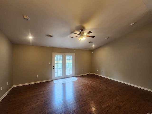 empty room with dark hardwood / wood-style floors and ceiling fan