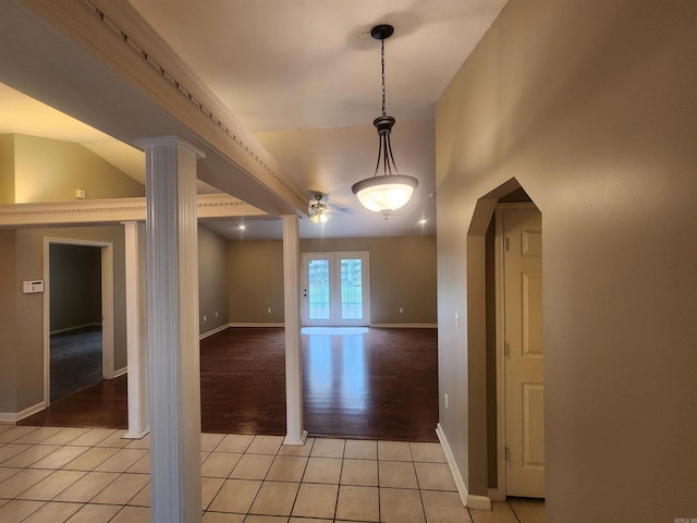 interior space featuring ornate columns and light wood-type flooring