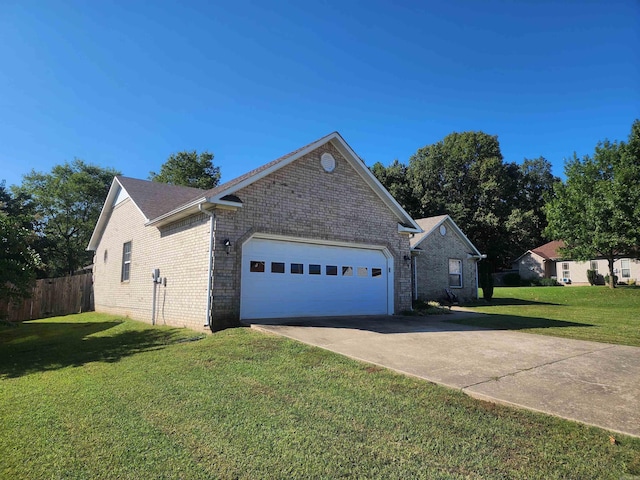 view of side of home with a garage and a lawn