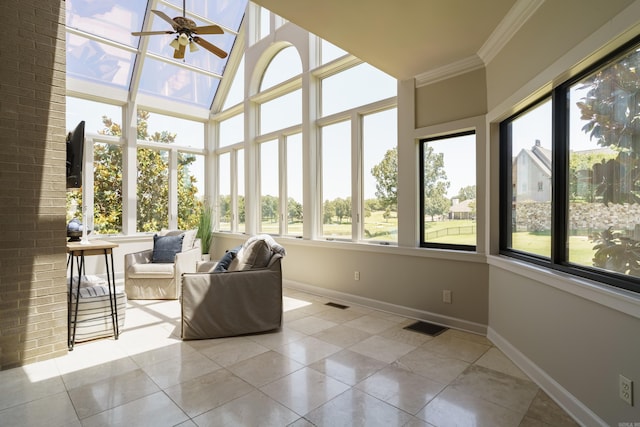 unfurnished sunroom with ceiling fan