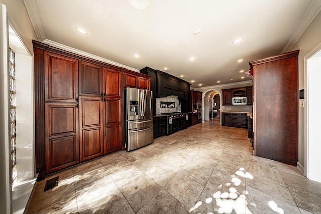 kitchen with crown molding, backsplash, and stainless steel appliances