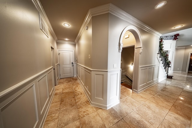 hallway featuring ornamental molding