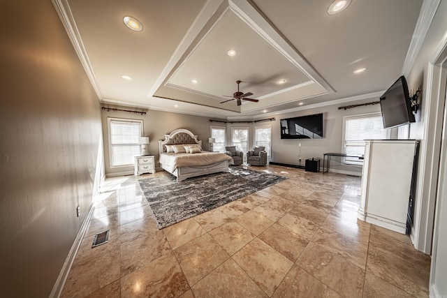 bedroom featuring a tray ceiling and multiple windows