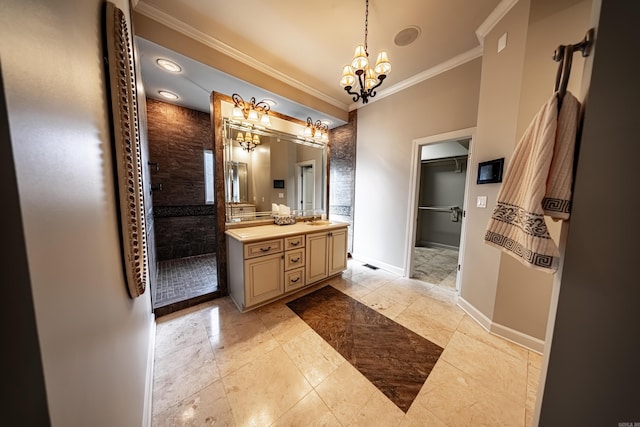 bathroom featuring vanity, an inviting chandelier, a tile shower, tile patterned flooring, and ornamental molding