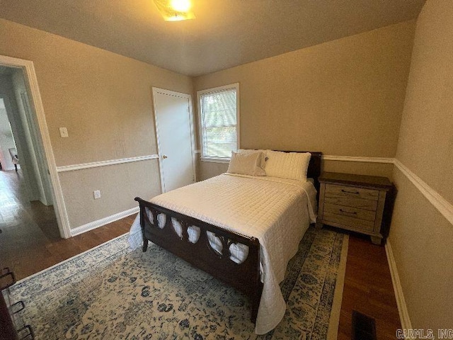 bedroom featuring dark hardwood / wood-style floors