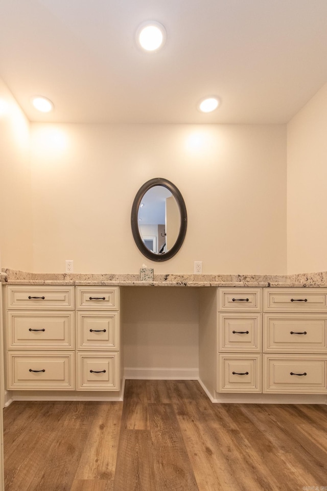 bathroom with vanity and wood-type flooring