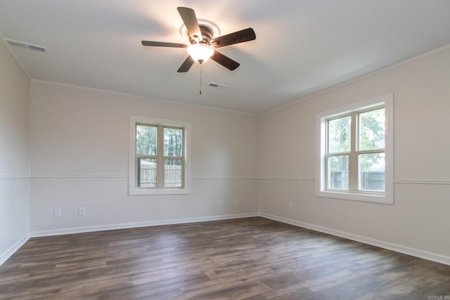 spare room featuring ceiling fan, ornamental molding, and dark hardwood / wood-style flooring