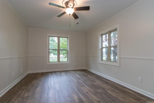 unfurnished room featuring ceiling fan, ornamental molding, and dark hardwood / wood-style flooring