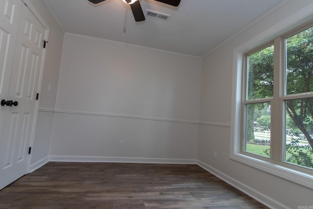 unfurnished room with ornamental molding, a healthy amount of sunlight, ceiling fan, and dark hardwood / wood-style floors