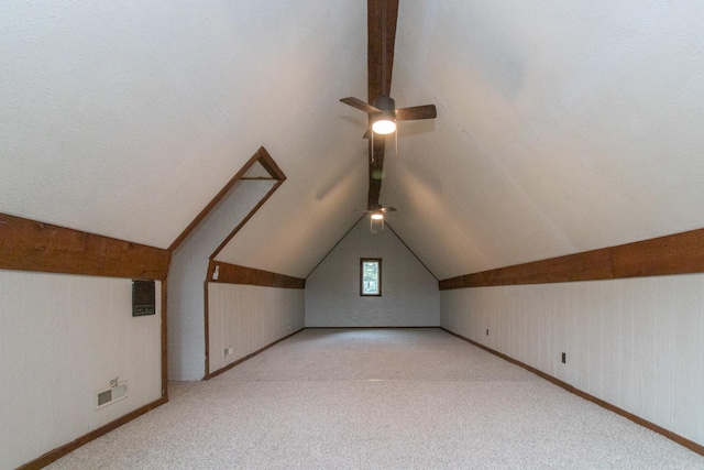 bonus room featuring lofted ceiling, ceiling fan, and light carpet