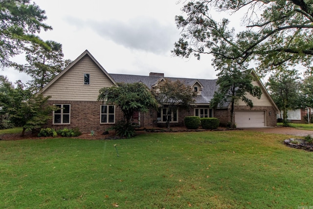 view of front facade with a garage and a front lawn