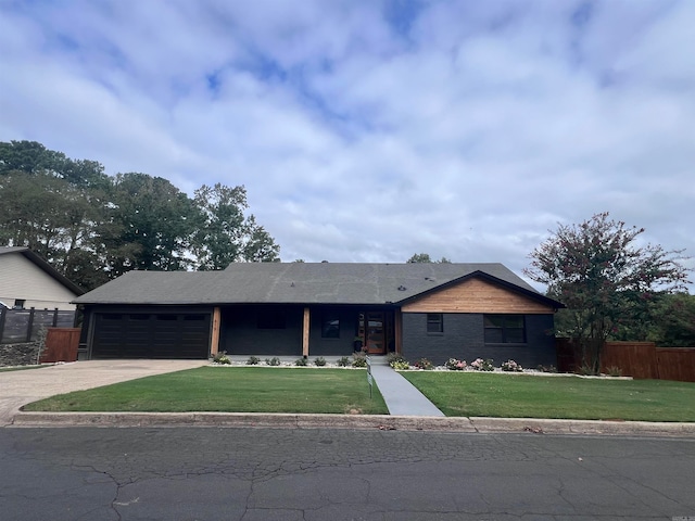 single story home featuring a front yard and a garage