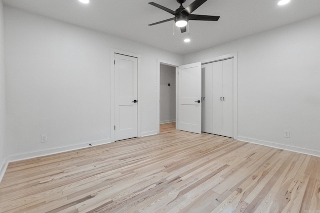 unfurnished bedroom featuring ceiling fan and light wood-type flooring