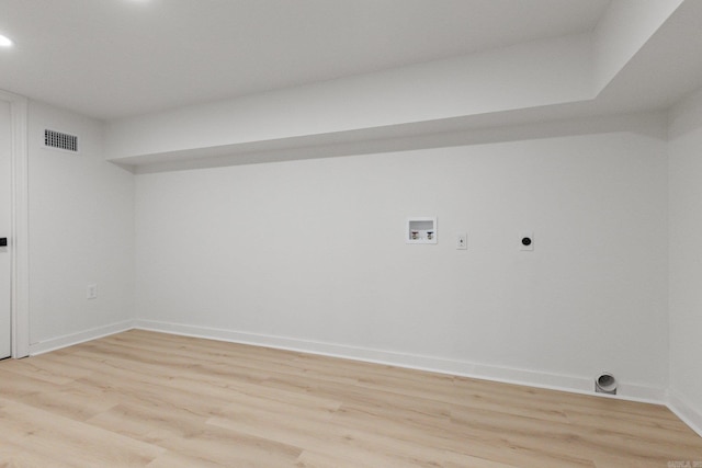 laundry area featuring hookup for a washing machine, hookup for an electric dryer, and light hardwood / wood-style floors