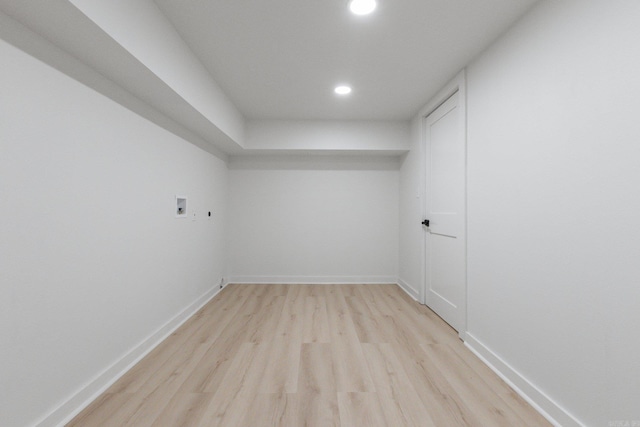 empty room with light hardwood / wood-style flooring