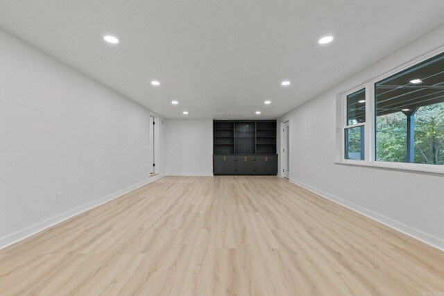 unfurnished living room with light wood-type flooring