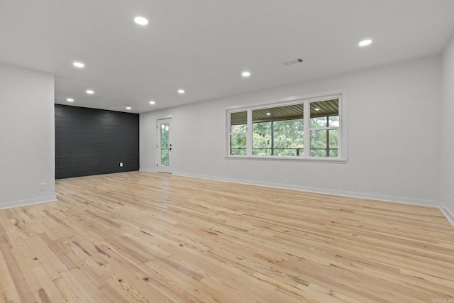 unfurnished living room with light hardwood / wood-style flooring