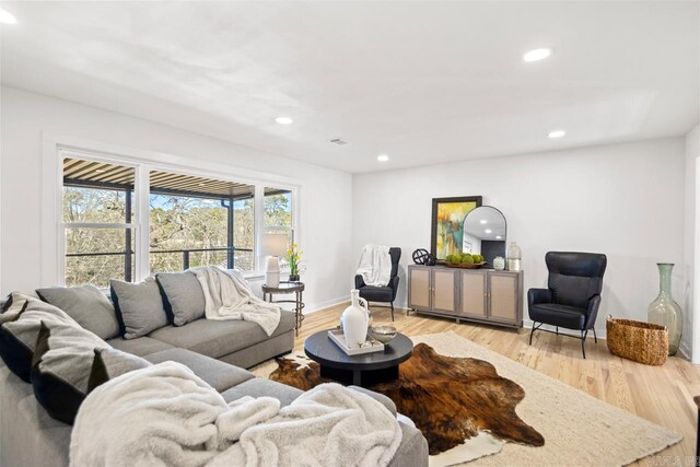 unfurnished living room with light hardwood / wood-style flooring