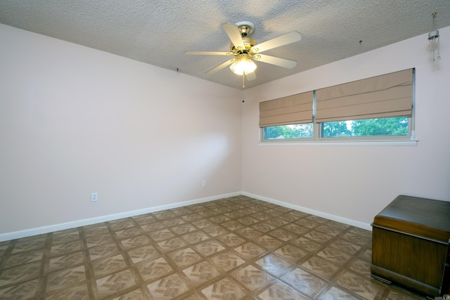 spare room featuring ceiling fan and a textured ceiling